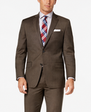 A man wearing a brown two-piece suit with a light blue patterned dress shirt and a red and blue plaid tie, photographed against a clean white background.